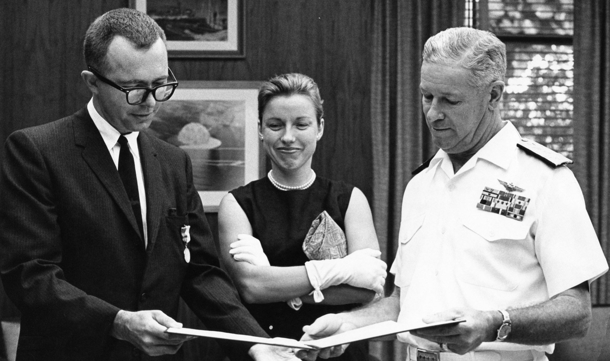 George Haering receives the Navy Distinguished Public Service award from Admiral Roy Johnson, 1965