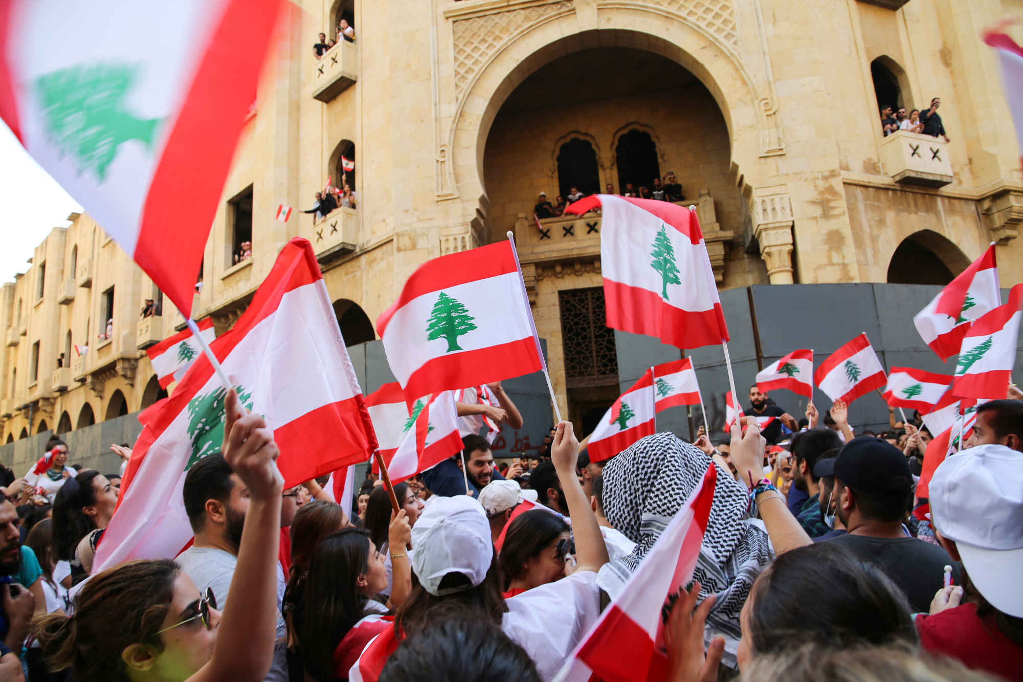 Lebanese flag waving at an outdoor rally