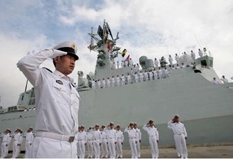 PLA naval soldiers saluting a naval vessel