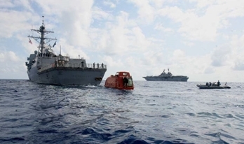 Several boats in the ocean