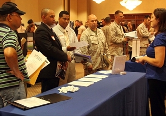 Servicemembers browse through booths at the Hiring our Heroes job fair at the Pacific Views Event Center on 19 September 2013. The fair was held to help servicemembers who are transitioning back into civilian life to find work.