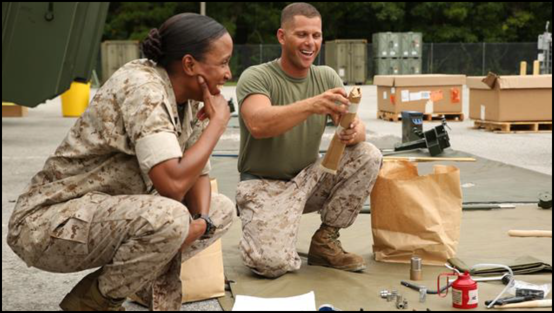 Male and female marine during a limited technical inspection