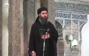 This is an image of the purported leader of The Islamic State in Iraq and the Levant (ISIL), Abu Bakr Al-Baghdadi, delivering a sermon on Mosul, Iraq on July 5, 2014. 