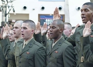 Officer candidates from Class 220 recite the Oath of Office during their commissioning ceremony on November 24, 2015, at the National Museum of the Marine Corps in Triangle, Virginia. These new second lieutenants now head to The Basic School