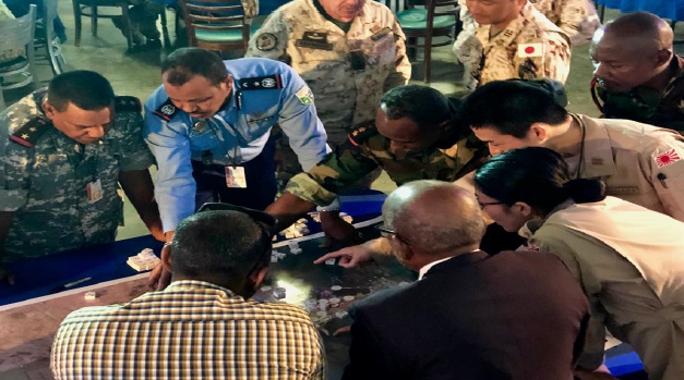Various military officers gathered around a table