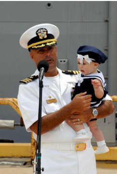 naval officer holding baby