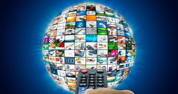 Remote control choosing Chinese media channels laid across a globe