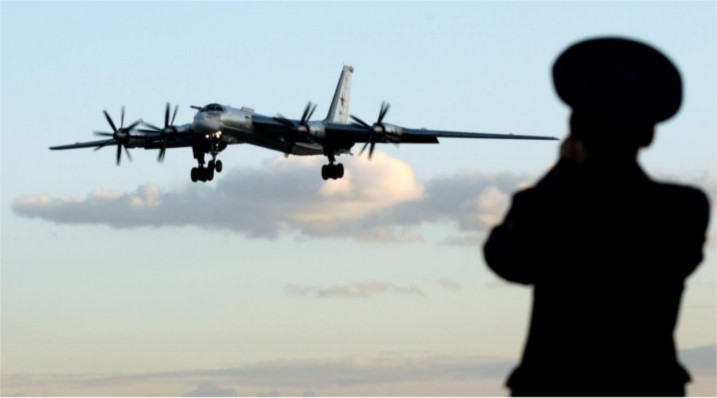  Sergei Karpukhin, “A Russian officer takes a picture of a TU-95 bomber, or Bear, at a military airbase in Engels some 900 km (559 miles) south of Moscow August 7, 2008. The Russian defence ministry invited journalists on a tour of the base that is home to a part of the country's wide range bomber fleet,” Reuters, August 7, 2008, https://pictures.reuters.com/archive/RUSSIA-BOMBERS--GM1E49P0UF001.html