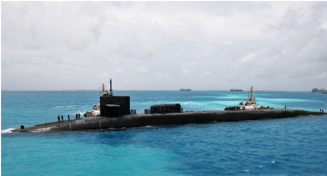 The Ohio-class guided-missile submarine USS Georgia (SSGN 729) prepares to moor outboard of the submarine tender USS Emory S. Land