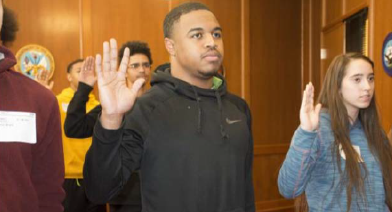 Jalen Terrell Moses swears-in to the U.S. Army Reserves at the Oklahoma City MEPS on January 30, 2019. Jalen follows his father's footsteps by joining the Army. His father, Sgt. 1st Class Rodney Moses, is set to retire after 32 years of service.