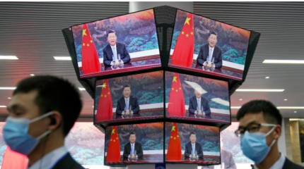 China's President Xi Jinping is seen on screens in the media center as he speaks at the opening ceremony of the third China International Import Expo (CIIE) in Shanghai, China November 4, 2020. REUTERS/Aly Song