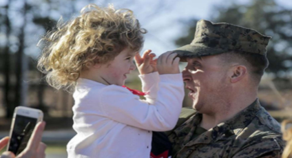 Soldier holding child