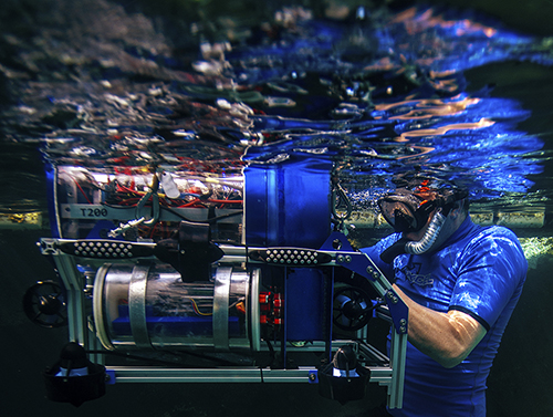 man testing underwater robot 