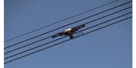 A small drone caught in power lines
