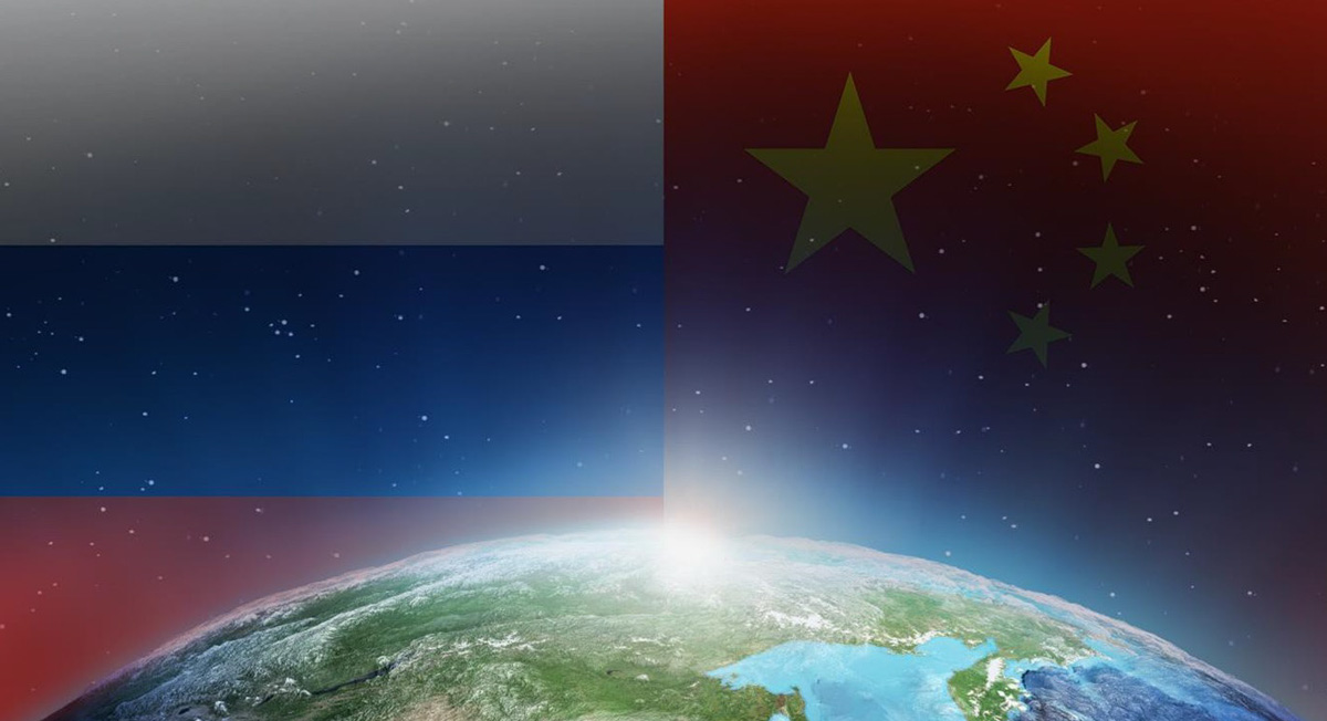 view of earth from space with the Russian and Chinese flags faded in the background
