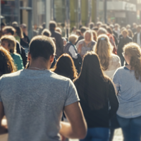 People walking down a crowded street