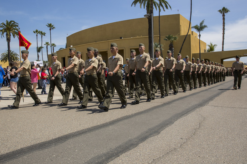 Military unit marching in street