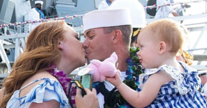  Boatswain's Mate 2nd Class Kyle Woody, assigned to the Arleigh-Burke-class guided-missile destroyer, USS William P. Lawrence (DDG 110), is welcomed by his family during a homecoming celebration. William P. Lawrence returned to its homeport of Pearl Harbor following a successful deployment to the 3rd and 7th Fleet areas of operations.