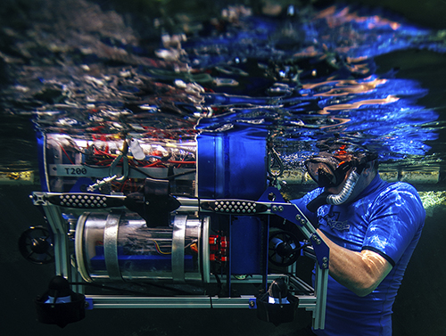 man testing underwater robot